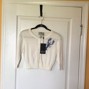 Ivory/Cream with blue lobster cardigan.